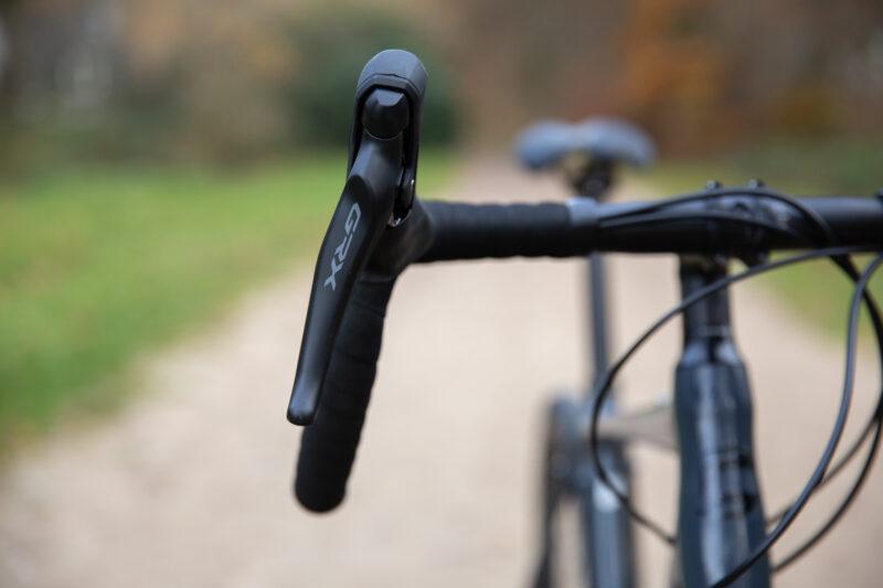 A gravel bike handlebar often has a larger flare than a road bike handlebar.