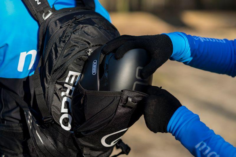 In some cycling backpacks a large helmet fits easily in a dedicated storage compartment.